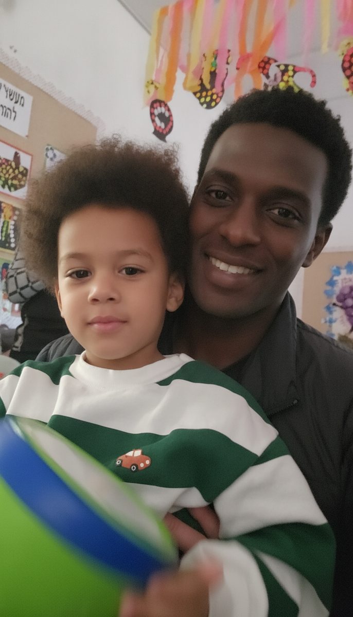 A dad and his boy in a selfie at kindergarten